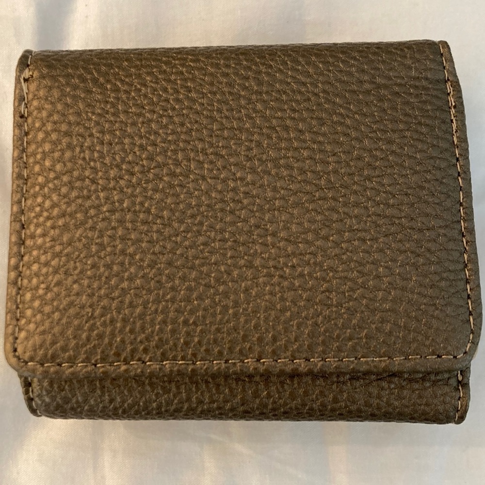 Faux leather PVC dual-sided wallet with snap closures. Card/bill holder